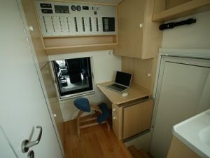 Camper Van which looks like a Dustbin Wagon Camper Van Office